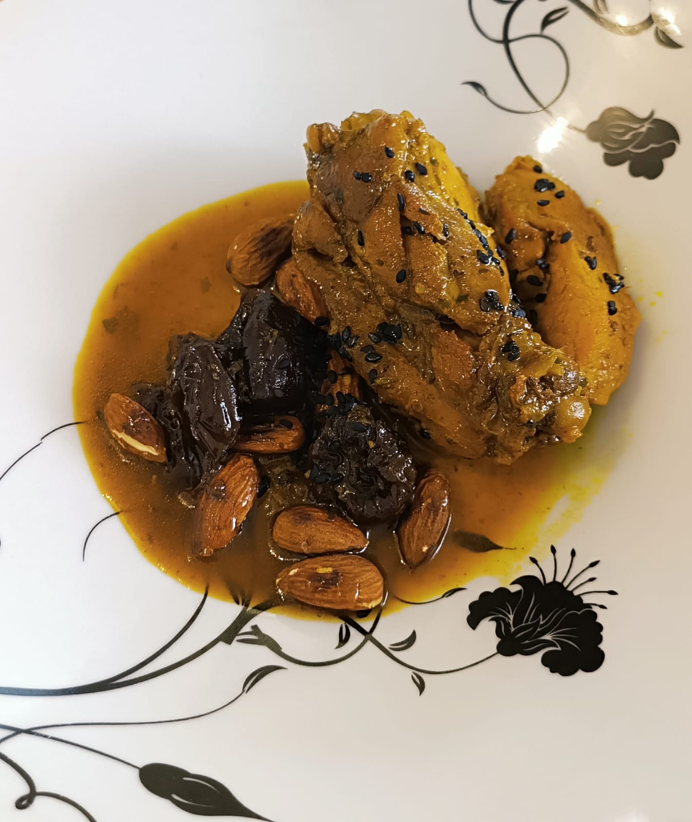 Chicken with prunes and almonds. Photo by Andres Aulestia