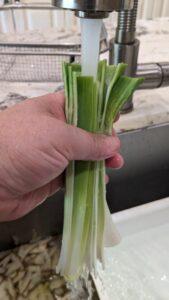 Cleaning leeks under faucet